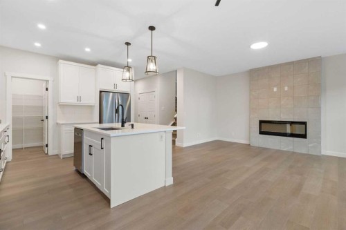 334 Rivercrest Road, Cochrane, AB - Indoor With Fireplace