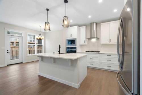 334 Rivercrest Road, Cochrane, AB - Indoor Photo Showing Kitchen With Stainless Steel Kitchen With Upgraded Kitchen