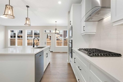 334 Rivercrest Road, Cochrane, AB - Indoor Photo Showing Kitchen With Upgraded Kitchen
