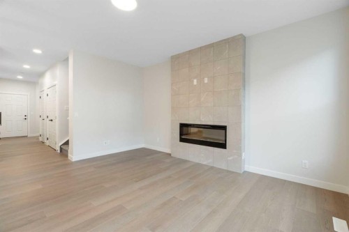 334 Rivercrest Road, Cochrane, AB - Indoor Photo Showing Living Room With Fireplace