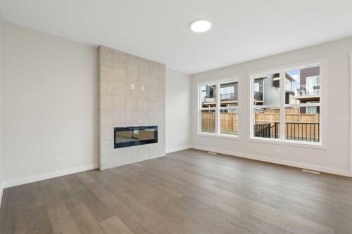 334 Rivercrest Road, Cochrane, AB - Indoor Photo Showing Living Room With Fireplace