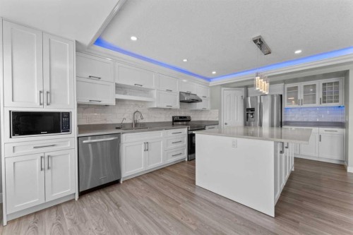 28 Panamount Lane Nw, Calgary, AB - Indoor Photo Showing Kitchen With Stainless Steel Kitchen With Upgraded Kitchen