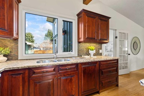 36 Lake Twintree Place Se, Calgary, AB - Indoor Photo Showing Kitchen With Double Sink