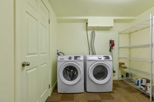 36 Lake Twintree Place Se, Calgary, AB - Indoor Photo Showing Laundry Room
