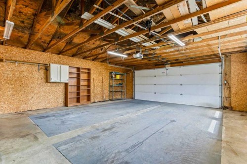 36 Lake Twintree Place Se, Calgary, AB - Indoor Photo Showing Garage