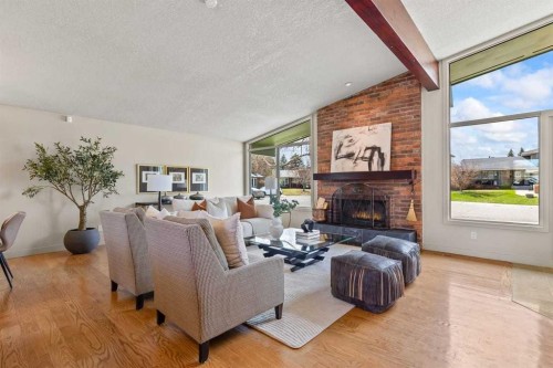 36 Lake Twintree Place Se, Calgary, AB - Indoor Photo Showing Living Room With Fireplace