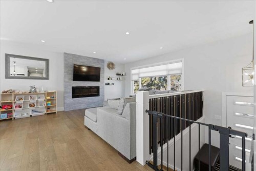 719 Allden Place Se, Calgary, AB - Indoor Photo Showing Living Room With Fireplace