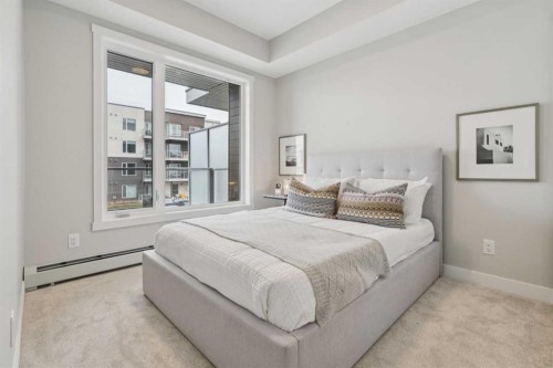201-655 Shawnee Square Sw, Calgary, AB - Indoor Photo Showing Bedroom