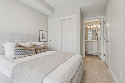 201-655 Shawnee Square Sw, Calgary, AB - Indoor Photo Showing Bedroom