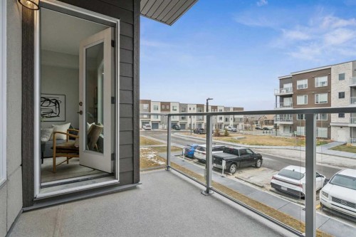 201-655 Shawnee Square Sw, Calgary, AB - Outdoor With Balcony With Exterior