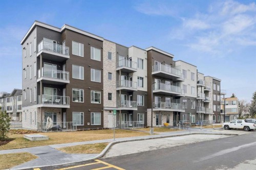 201-655 Shawnee Square Sw, Calgary, AB - Outdoor With Balcony With Facade