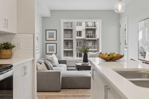 201-655 Shawnee Square Sw, Calgary, AB - Indoor Photo Showing Kitchen With Double Sink
