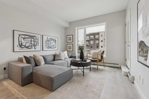 201-655 Shawnee Square Sw, Calgary, AB - Indoor Photo Showing Living Room