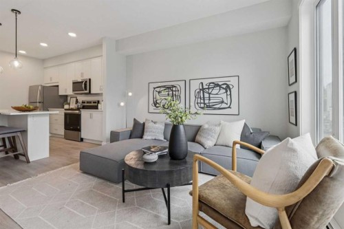 201-655 Shawnee Square Sw, Calgary, AB - Indoor Photo Showing Living Room