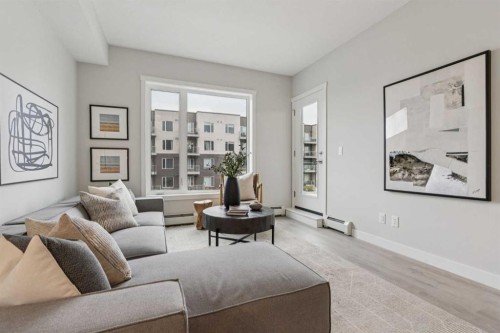 201-655 Shawnee Square Sw, Calgary, AB - Indoor Photo Showing Living Room