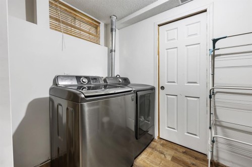 10 Big Springs Hill Se, Airdrie, AB - Indoor Photo Showing Laundry Room