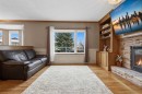 729 Woodbriar Place Sw, Calgary, AB  - Indoor Photo Showing Living Room With Fireplace 