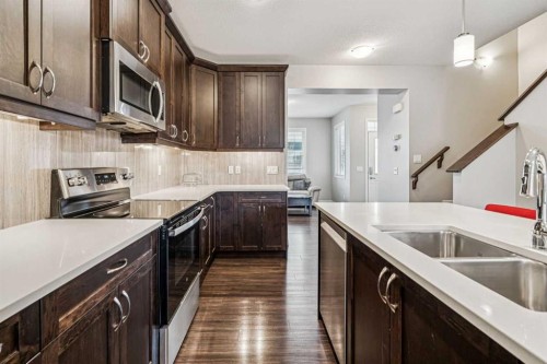 1565 Legacy Circle Se, Calgary, AB - Indoor Photo Showing Kitchen With Double Sink With Upgraded Kitchen