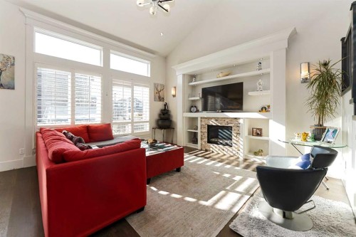 129 Kinniburgh Gardens, Chestermere, AB - Indoor Photo Showing Living Room With Fireplace