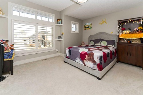 129 Kinniburgh Gardens, Chestermere, AB - Indoor Photo Showing Bedroom
