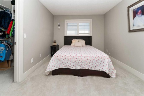 129 Kinniburgh Gardens, Chestermere, AB - Indoor Photo Showing Bedroom