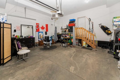 129 Kinniburgh Gardens, Chestermere, AB - Indoor Photo Showing Garage