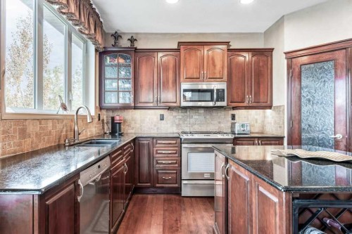 40 Cougar Ridge Heights Sw, Calgary, AB - Indoor Photo Showing Kitchen With Double Sink With Upgraded Kitchen