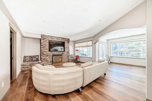 40 Cougar Ridge Heights Sw, Calgary, AB - Indoor Photo Showing Living Room With Fireplace