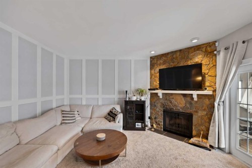 436 Ranchridge Bay Nw, Calgary, AB - Indoor Photo Showing Living Room With Fireplace