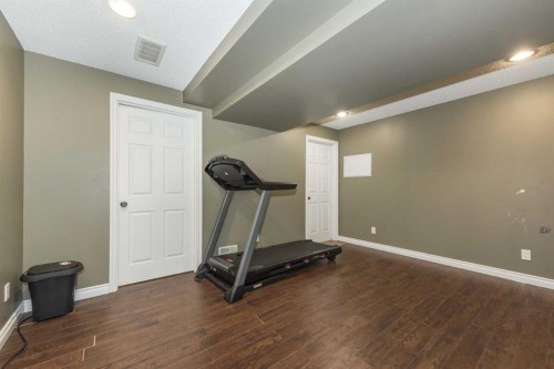 56 Evansbrooke Landing, Calgary, AB - Indoor Photo Showing Gym Room