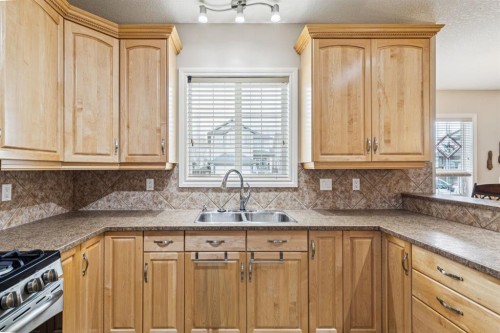 937 Cimarron Park Close, Okotoks, AB - Indoor Photo Showing Kitchen With Double Sink