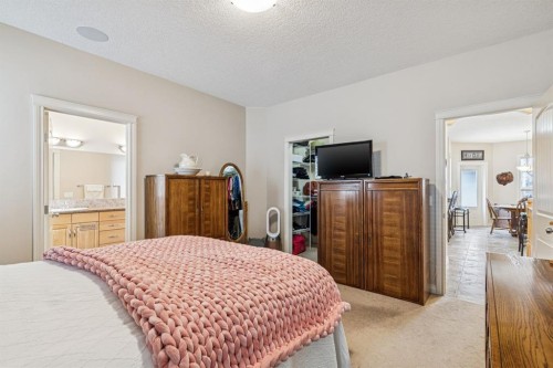 937 Cimarron Park Close, Okotoks, AB - Indoor Photo Showing Bedroom