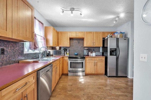 53 Shawfield Road Sw, Calgary, AB - Indoor Photo Showing Kitchen With Stainless Steel Kitchen With Double Sink