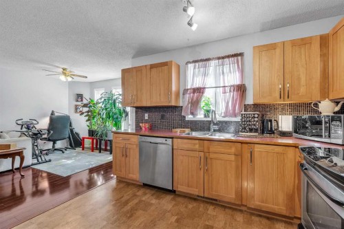 53 Shawfield Road Sw, Calgary, AB - Indoor Photo Showing Kitchen With Double Sink
