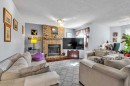 53 Shawfield Road Sw, Calgary, AB  - Indoor Photo Showing Living Room With Fireplace 