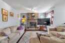 53 Shawfield Road Sw, Calgary, AB  - Indoor Photo Showing Living Room With Fireplace 