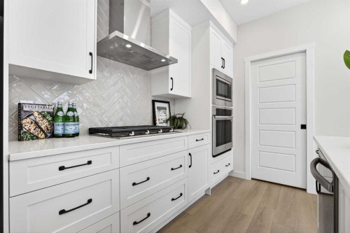 997 Alpine Drive Sw, Calgary, AB - Indoor Photo Showing Kitchen With Upgraded Kitchen