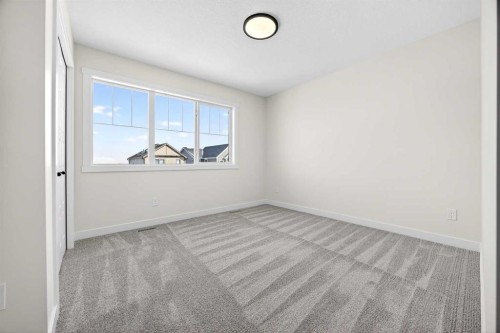 997 Alpine Drive Sw, Calgary, AB - Indoor Photo Showing Other Room