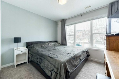 204 Sundown Road, Cochrane, AB - Indoor Photo Showing Bedroom