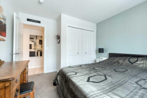 204 Sundown Road, Cochrane, AB - Indoor Photo Showing Bedroom