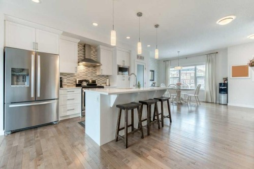 204 Sundown Road, Cochrane, AB - Indoor Photo Showing Kitchen With Stainless Steel Kitchen With Upgraded Kitchen