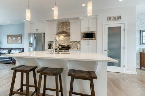 204 Sundown Road, Cochrane, AB - Indoor Photo Showing Kitchen With Stainless Steel Kitchen With Upgraded Kitchen