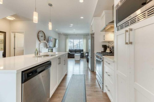 204 Sundown Road, Cochrane, AB - Indoor Photo Showing Kitchen With Upgraded Kitchen