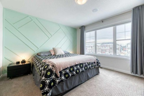 204 Sundown Road, Cochrane, AB - Indoor Photo Showing Bedroom