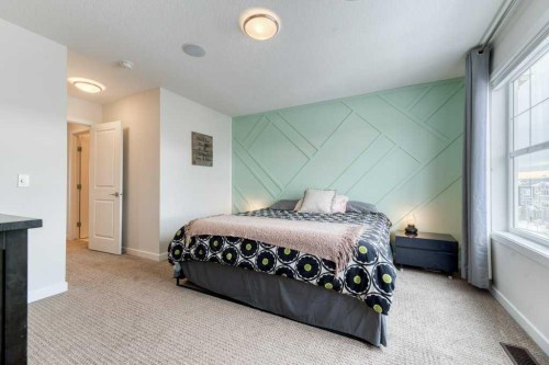 204 Sundown Road, Cochrane, AB - Indoor Photo Showing Bedroom