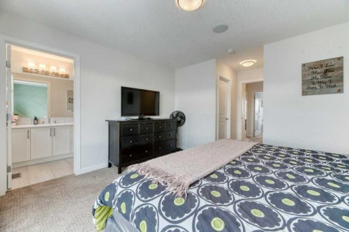 204 Sundown Road, Cochrane, AB - Indoor Photo Showing Bedroom
