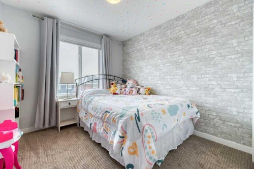204 Sundown Road, Cochrane, AB - Indoor Photo Showing Bedroom