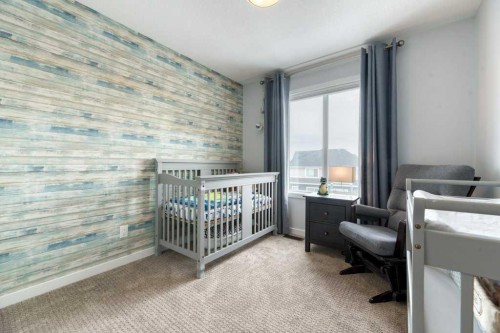 204 Sundown Road, Cochrane, AB - Indoor Photo Showing Bedroom