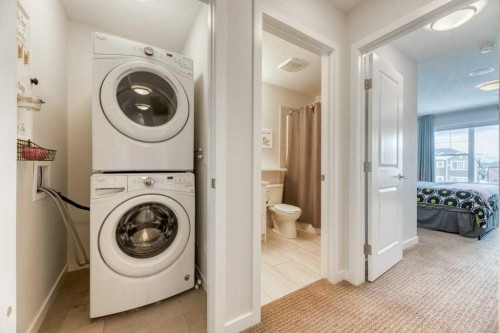 204 Sundown Road, Cochrane, AB - Indoor Photo Showing Laundry Room