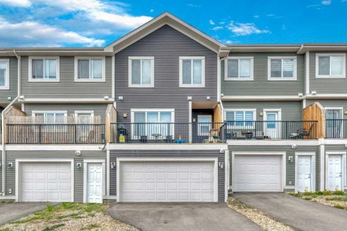 204 Sundown Road, Cochrane, AB - Outdoor With Facade